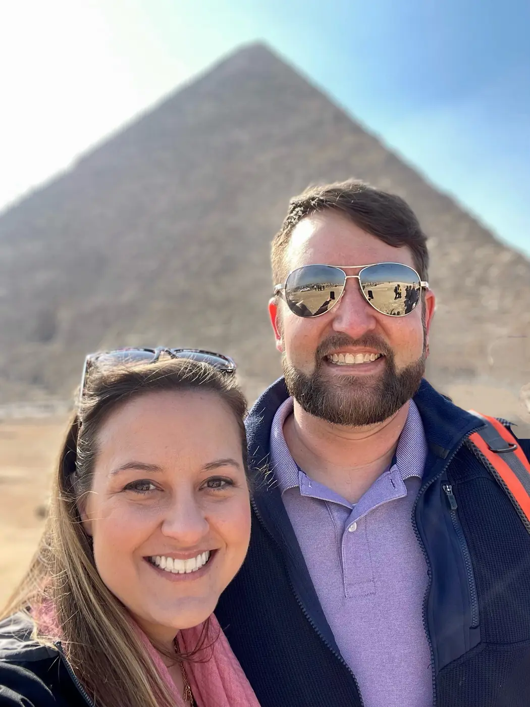 Eric and Allie smiling in front of the Great Pyramid