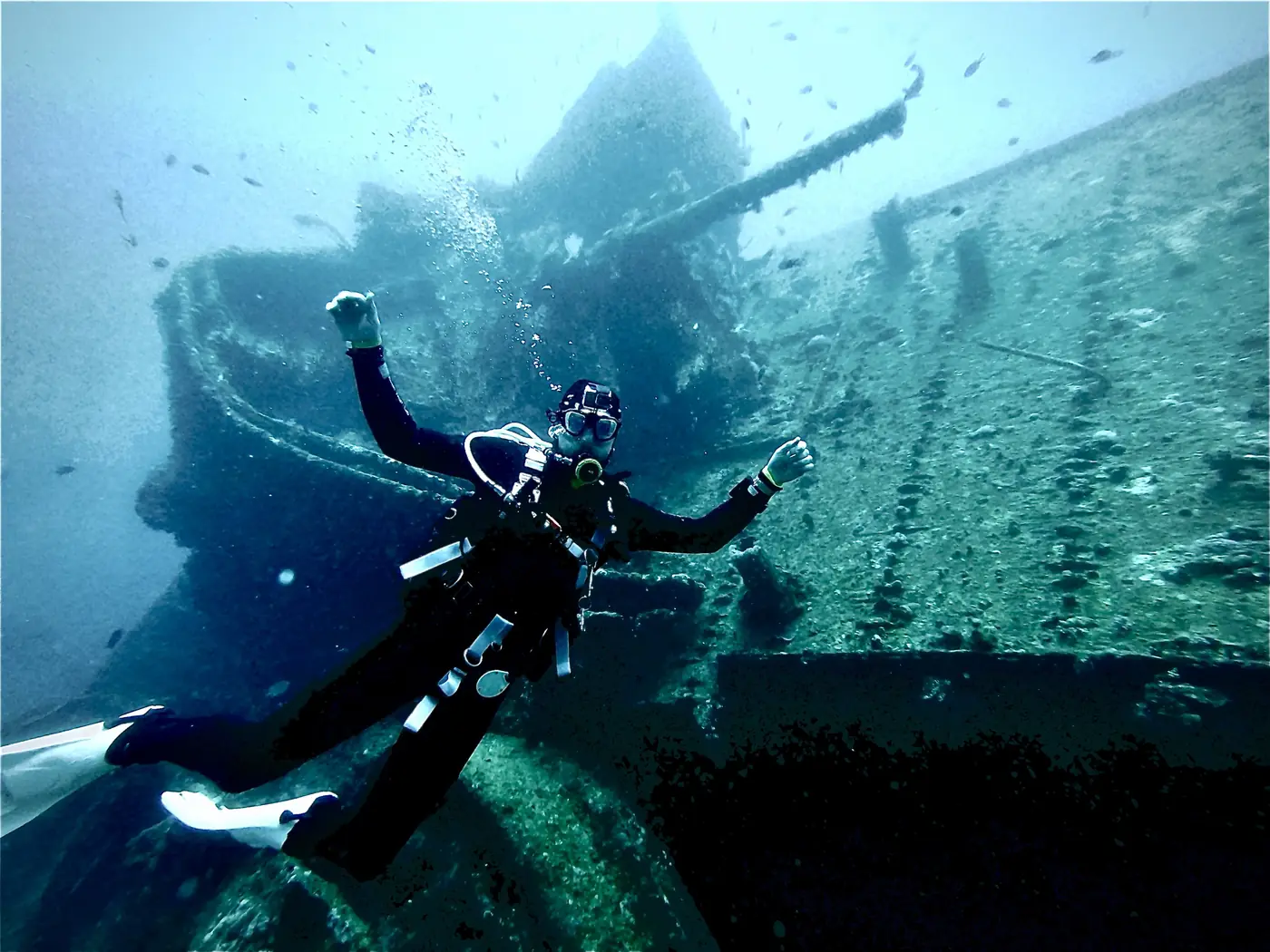 Eric above the deck, ship's gun behind